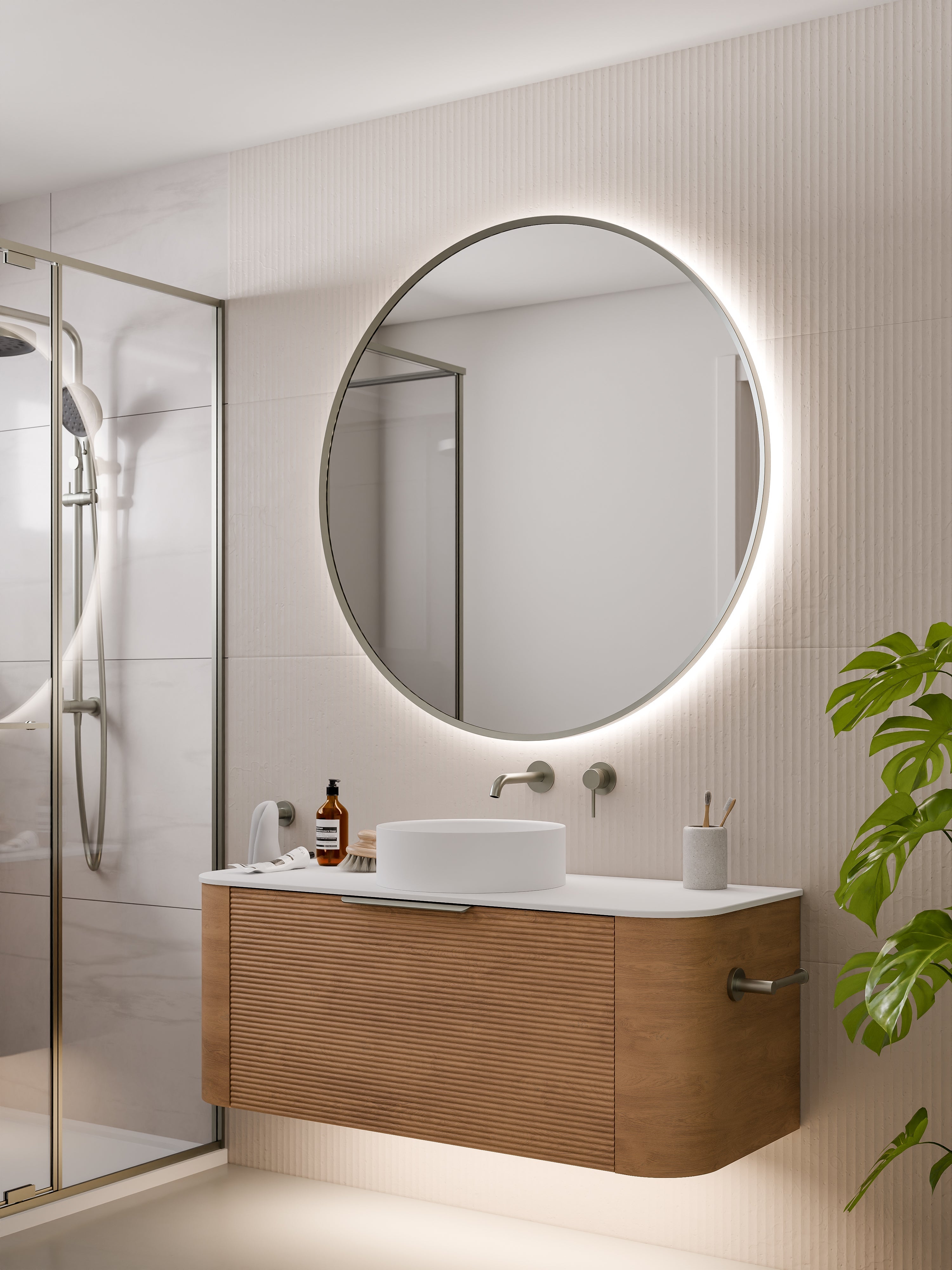 Bathroom with Aura round mirror as focal point above stone vanity with modern taps