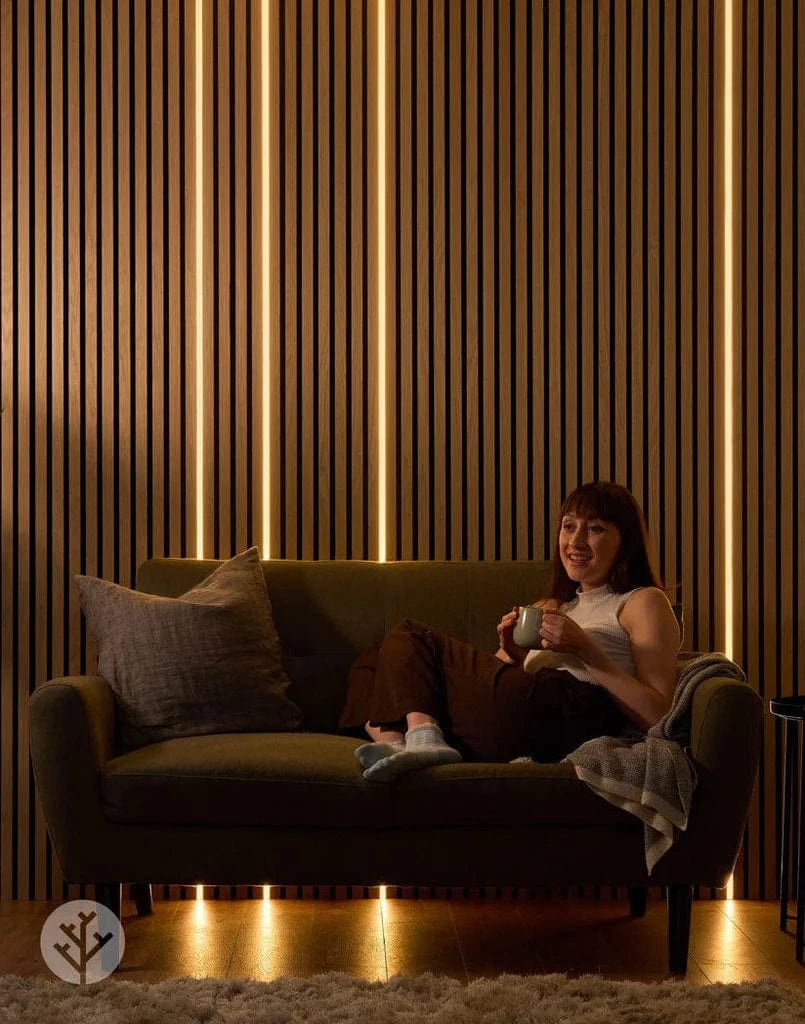 Acupanel Glow LED strip installed on oak wall in bedroom setting providing warm ambient lighting