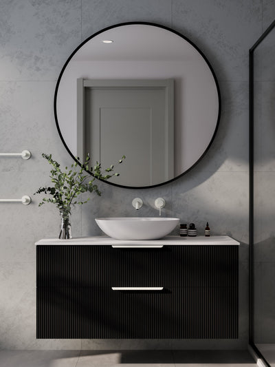 Code Interiors Aura LED round framed mirror with backlit glow on grey background