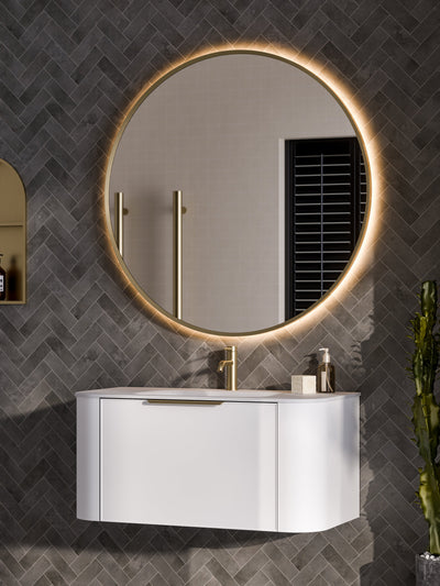 Side profile view of Aura round LED mirror showing slim frame depth and mounting system