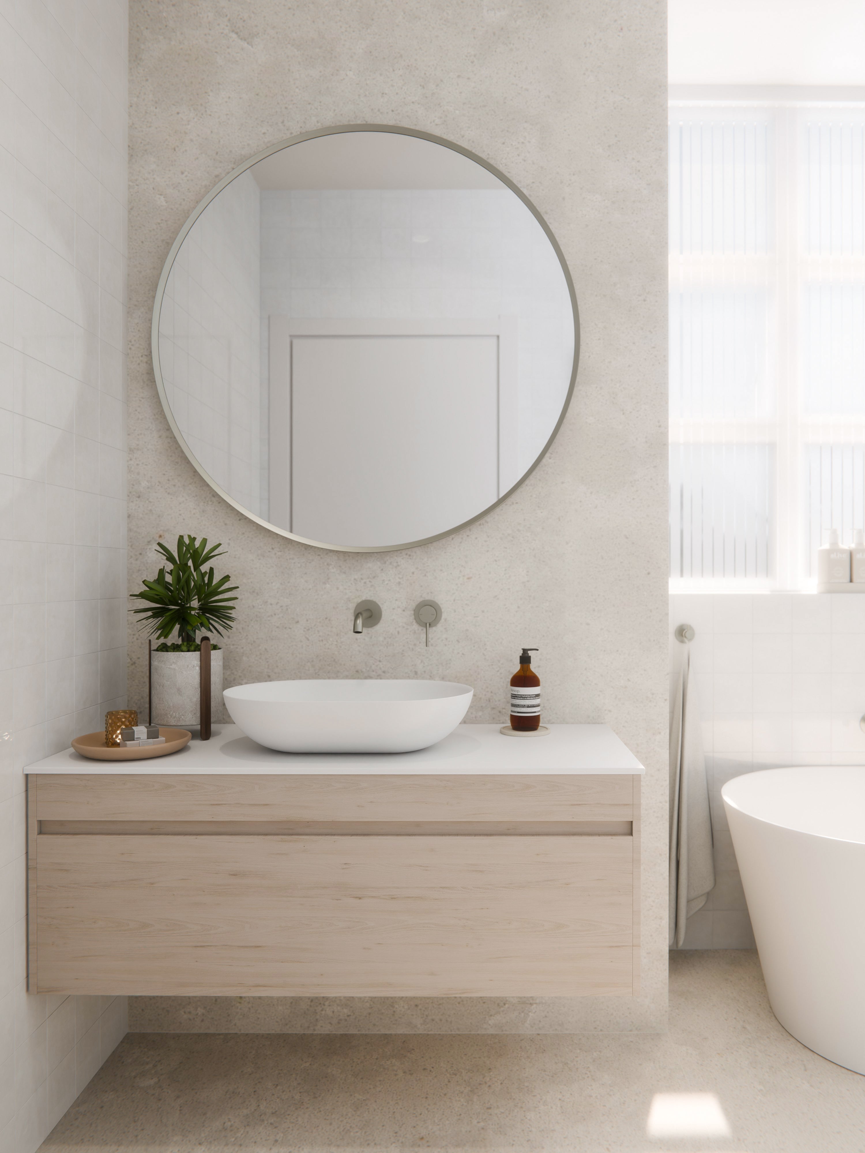 Close-up of touch sensor on Aura round mirror frame for LED brightness and colour control