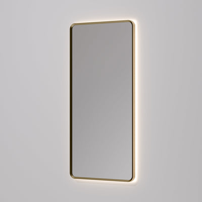 Aura rectangle mirror with LED backlight switched on in dimly lit bathroom setting
