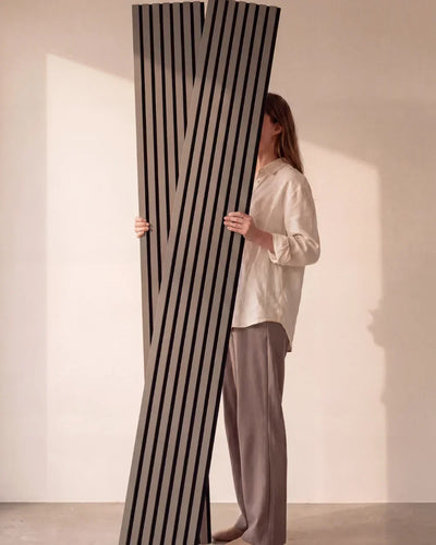 Acupanel Dusty Grey acoustic slat wall panels held in studio