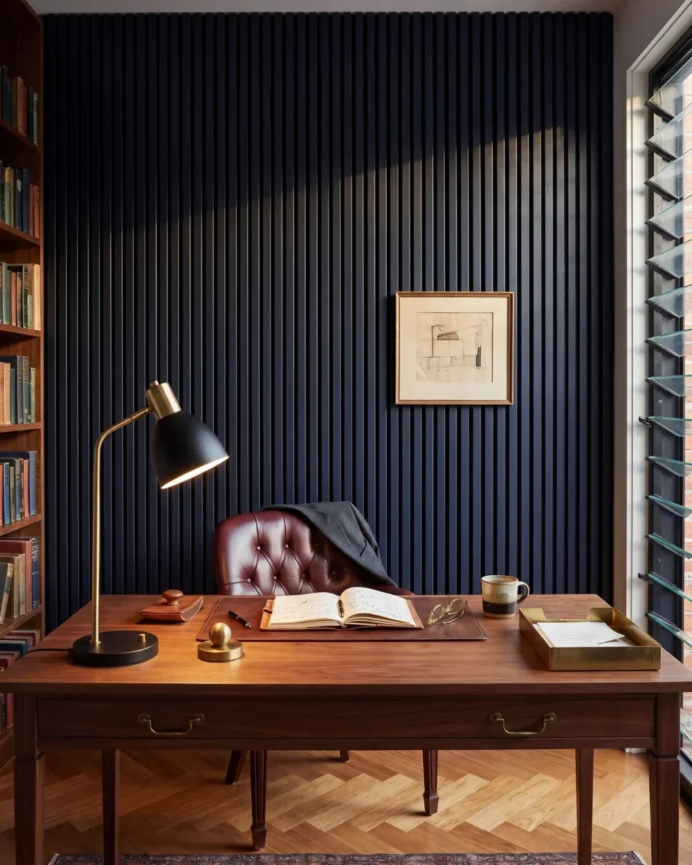 Acupanel Midnight Blue acoustic slat wall panels in a luxury office