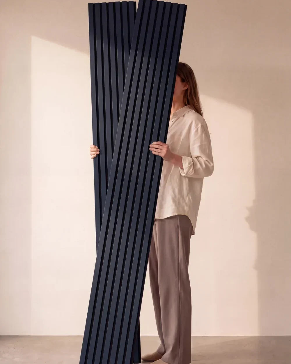 Acupanel Midnight Blue acoustic slat wall panels held in studio