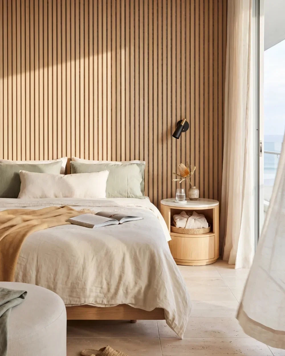 Acupanel Natural Oak (Grey Felt) acoustic slat wall panels in a bedroom