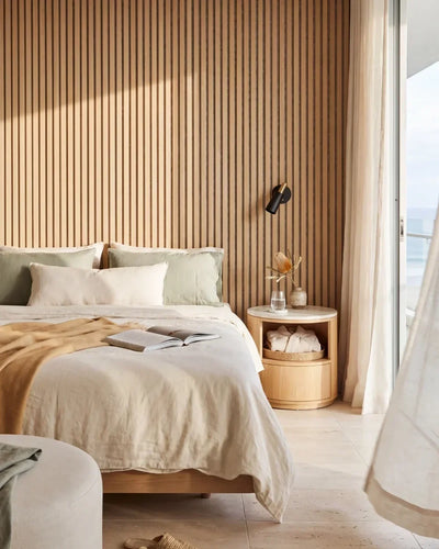 Acupanel Natural Oak (Grey Felt) acoustic slat wall panels in a bedroom