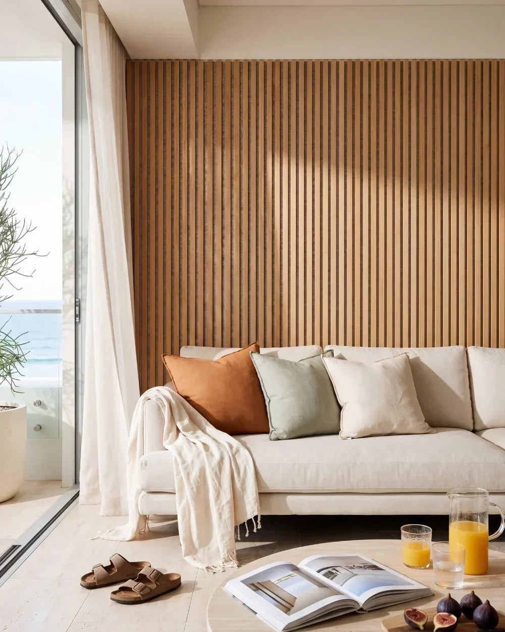 Acupanel Natural Oak (Grey Felt) acoustic slat wall panels in a coastal lounge