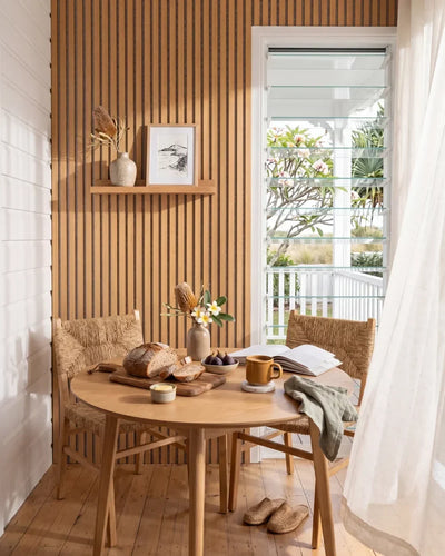 Acupanel Natural Oak (Grey Felt) acoustic slat wall panels in a sun room