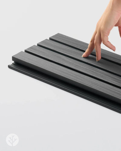 Side profile of Plaank grey composite panel showing hollow core and tongue-groove edge