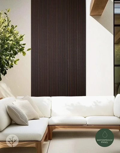 Modern home exterior with Plaank walnut composite slat panels as rich dark facade cladding