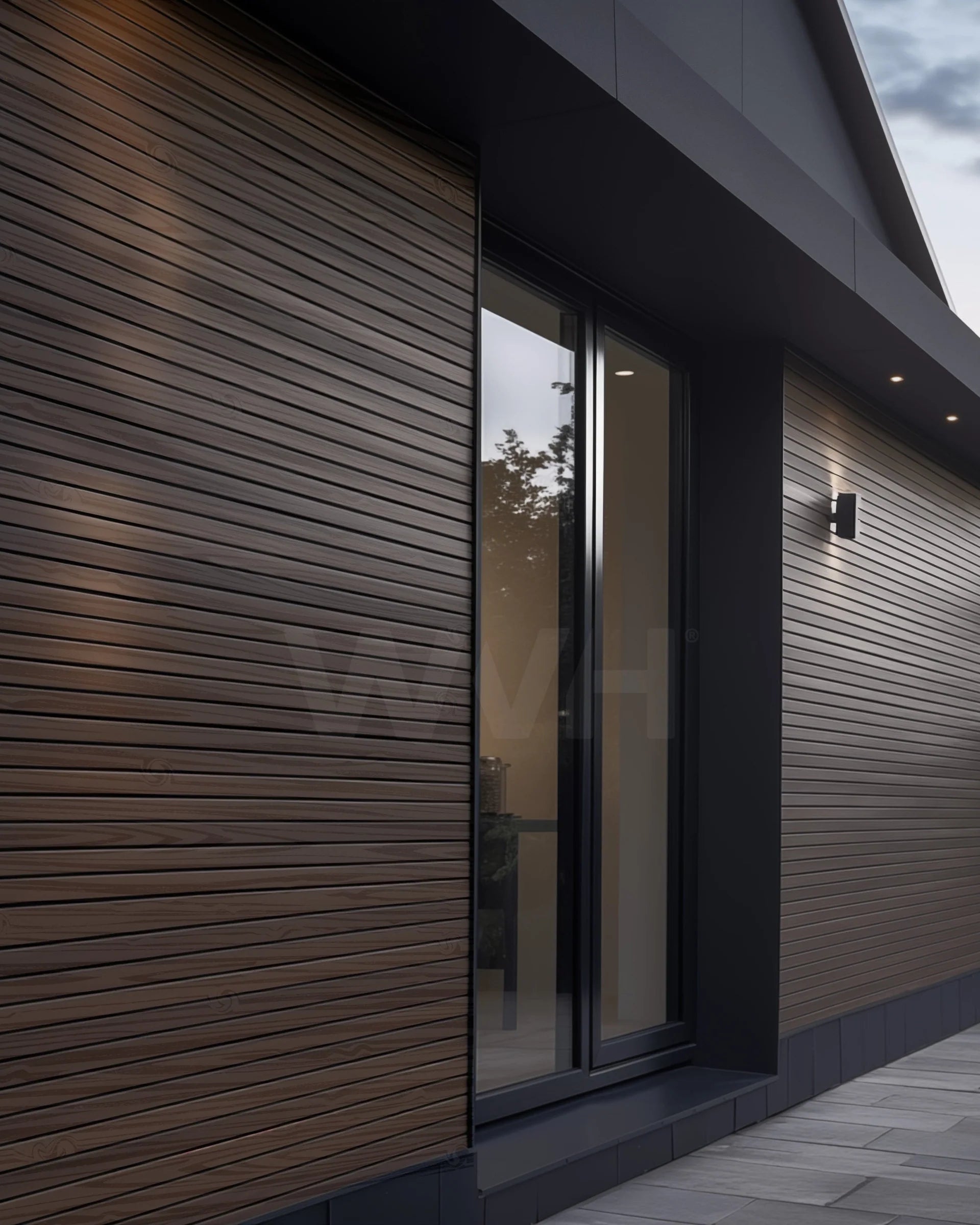 Plaank walnut exterior panels on garden wall creating modern privacy screening feature