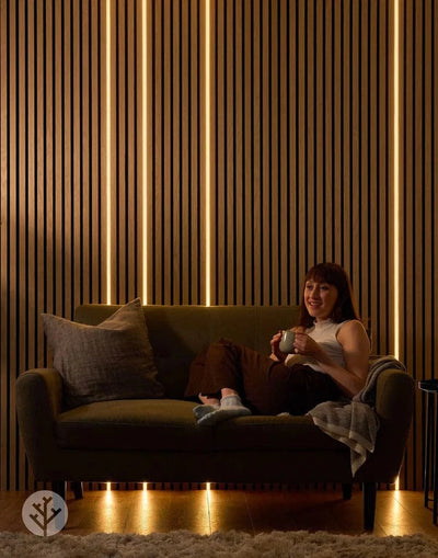 Acupanel Glow LED strip installed on oak wall in bedroom setting providing warm ambient lighting