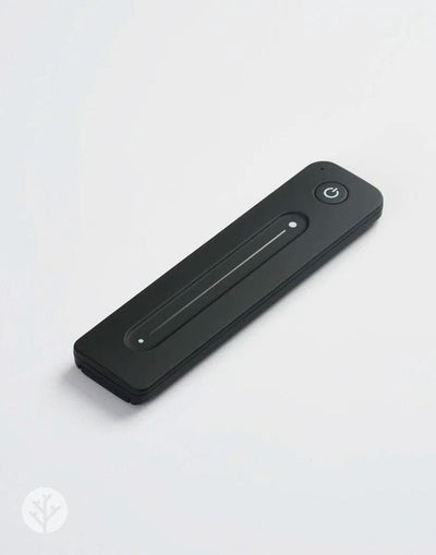Acupanel Glow LED remote control held in hand showing button layout for brightness and timer