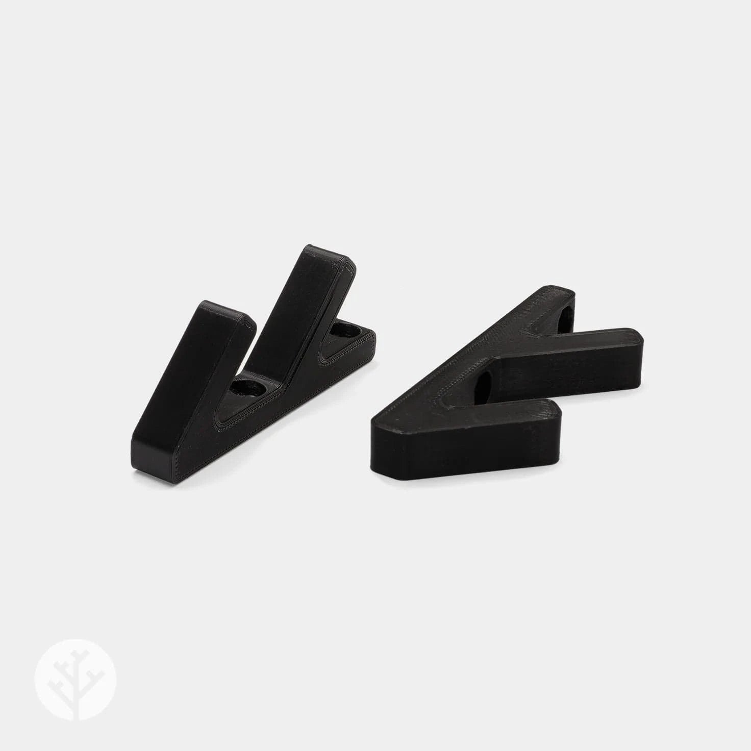 Two black 3D hooks shown from angled perspective revealing the V-shaped mounting profile