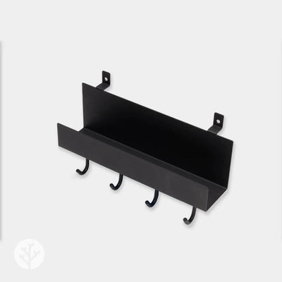 Hand hanging item on shelf hook demonstrating easy everyday use on Acupanel wall